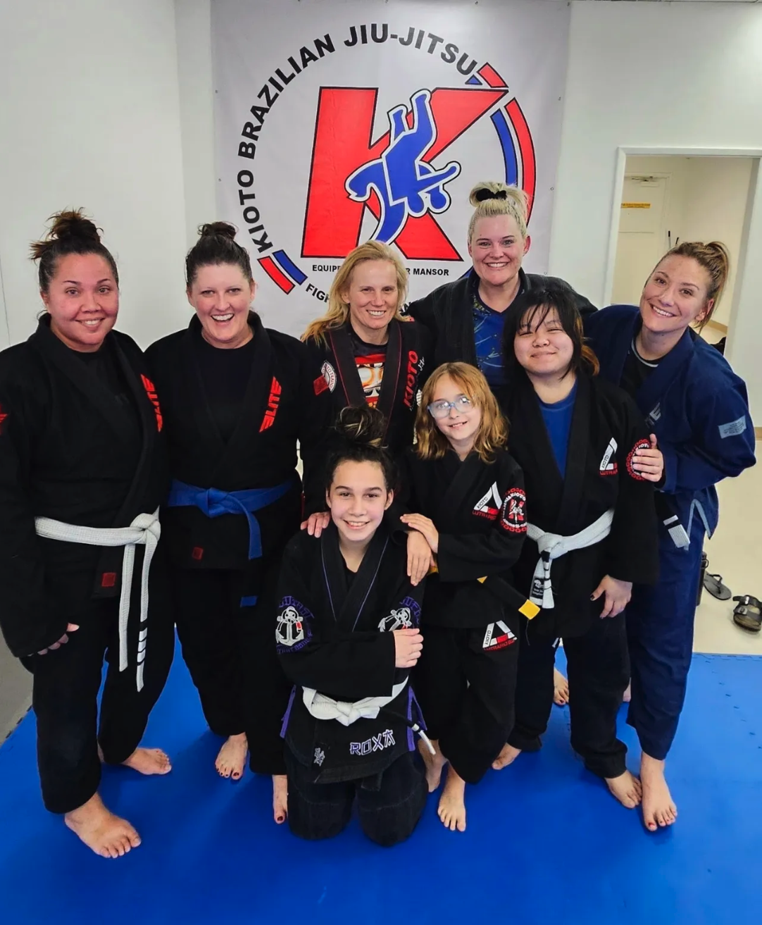 Kioto BJJ women and youth students under the Kioto banner